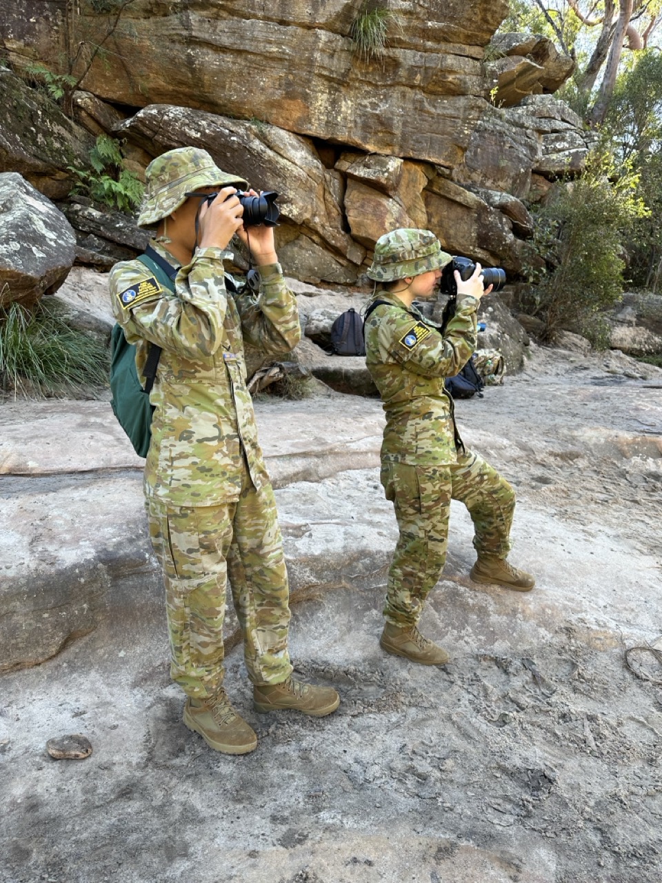 Image 2: Australian Army Cadets Lance Corporal Conrad Field and Lance Corporal Sheba Perry exploring the use of a camera as part of the Public Affairs One & Two elective at the Jellybean Pool, Blue Mountains National Park.